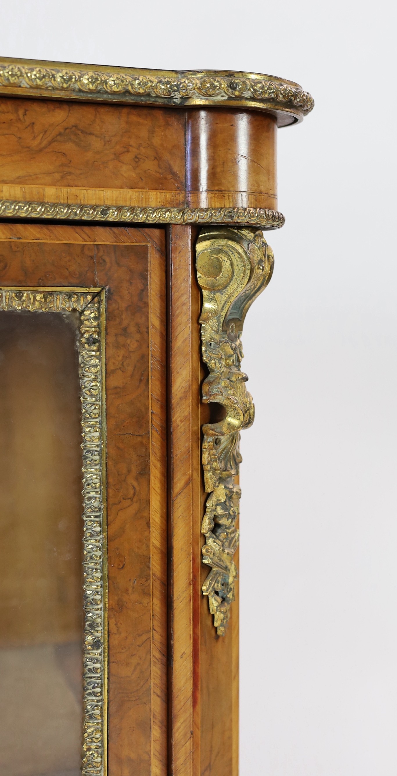 A 19th century French ormolu mounted figured walnut pier cabinet, width 90cm depth 40cm height 114cm